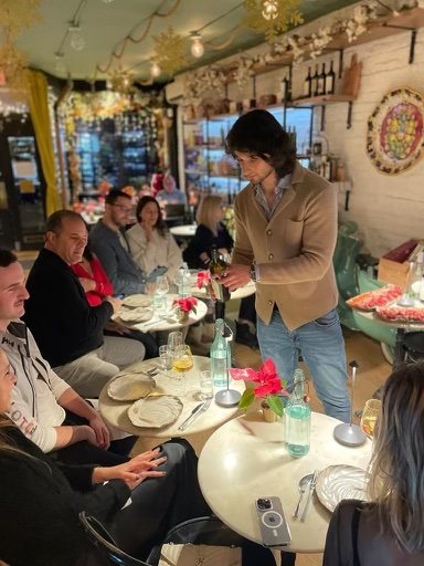 The Sogno Toscano team sharing a wine tasting around the table