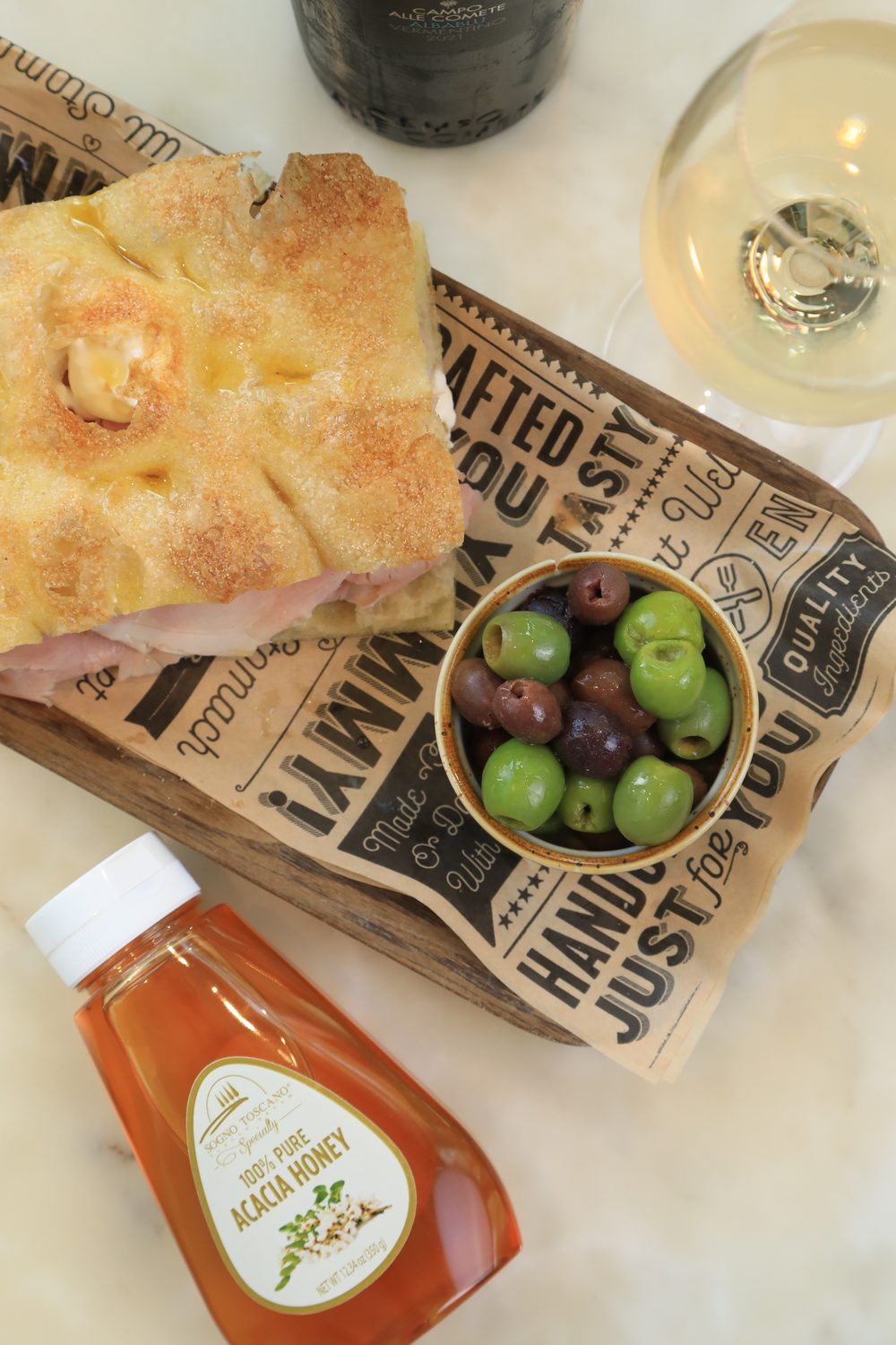 Schiacciata with olives and acacia honey