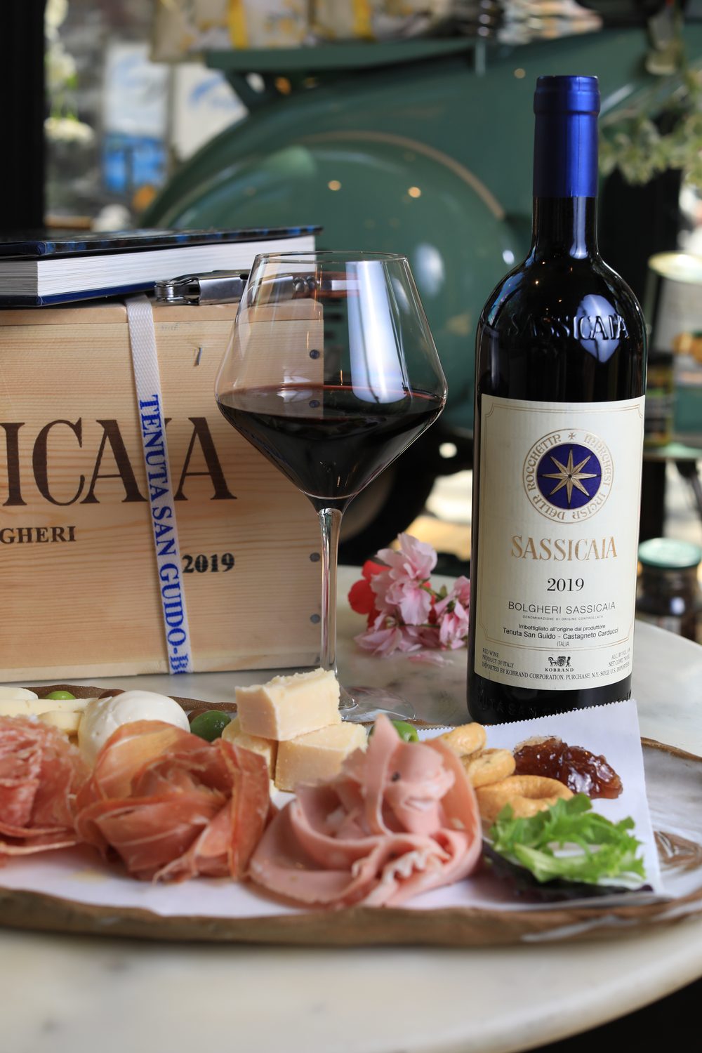Tuscan wine and a board of salumi and cheese